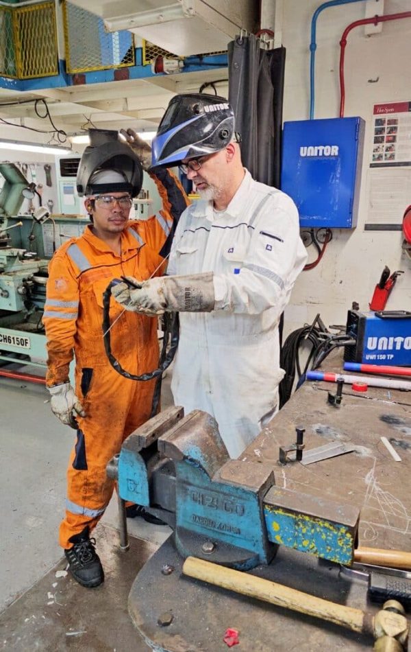 Davy teaching how to weld Davy teaching how to weld